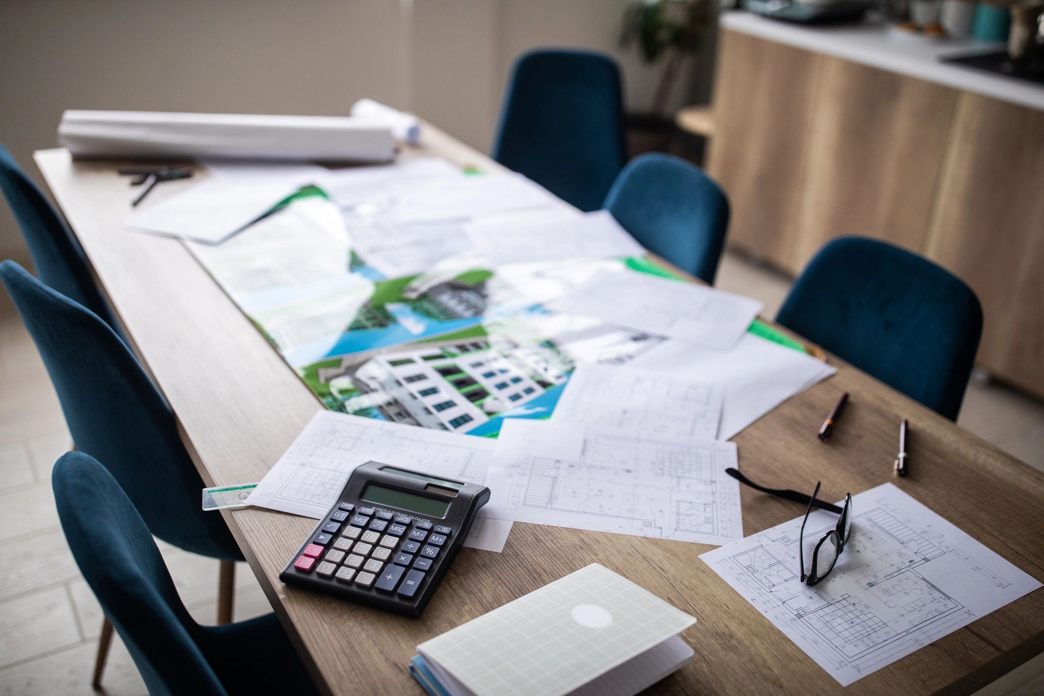 Architecture office table with building project materials